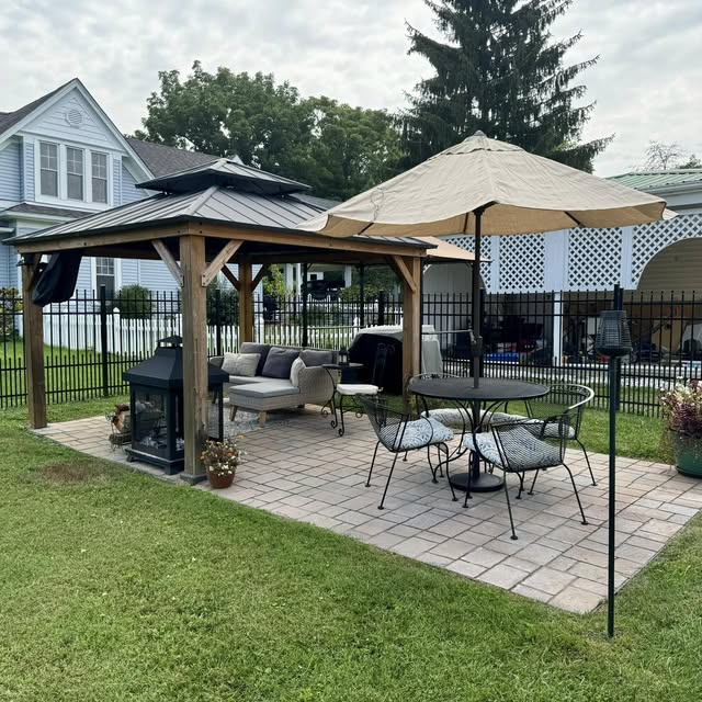 Backyard gazebo and patio seating area installed for outdoor living